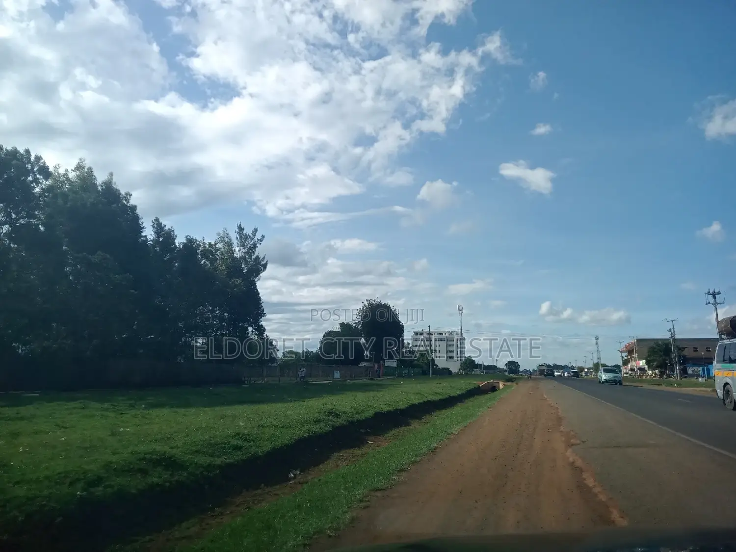 1-Acre Langas Land near Tarmac: Perfect for Development in Soy