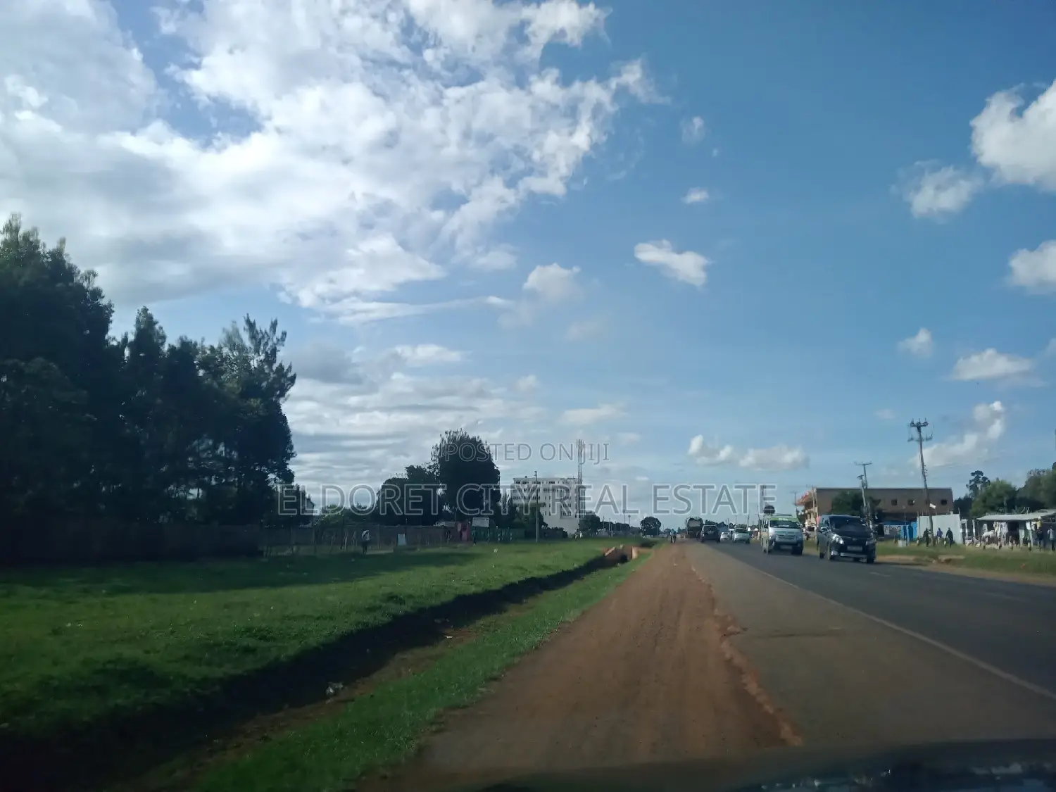 1-Acre Langas Land near Tarmac: Perfect for Development in Soy